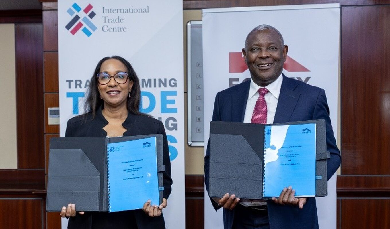 Officials pose after signing a trade support agreement in Nairobi