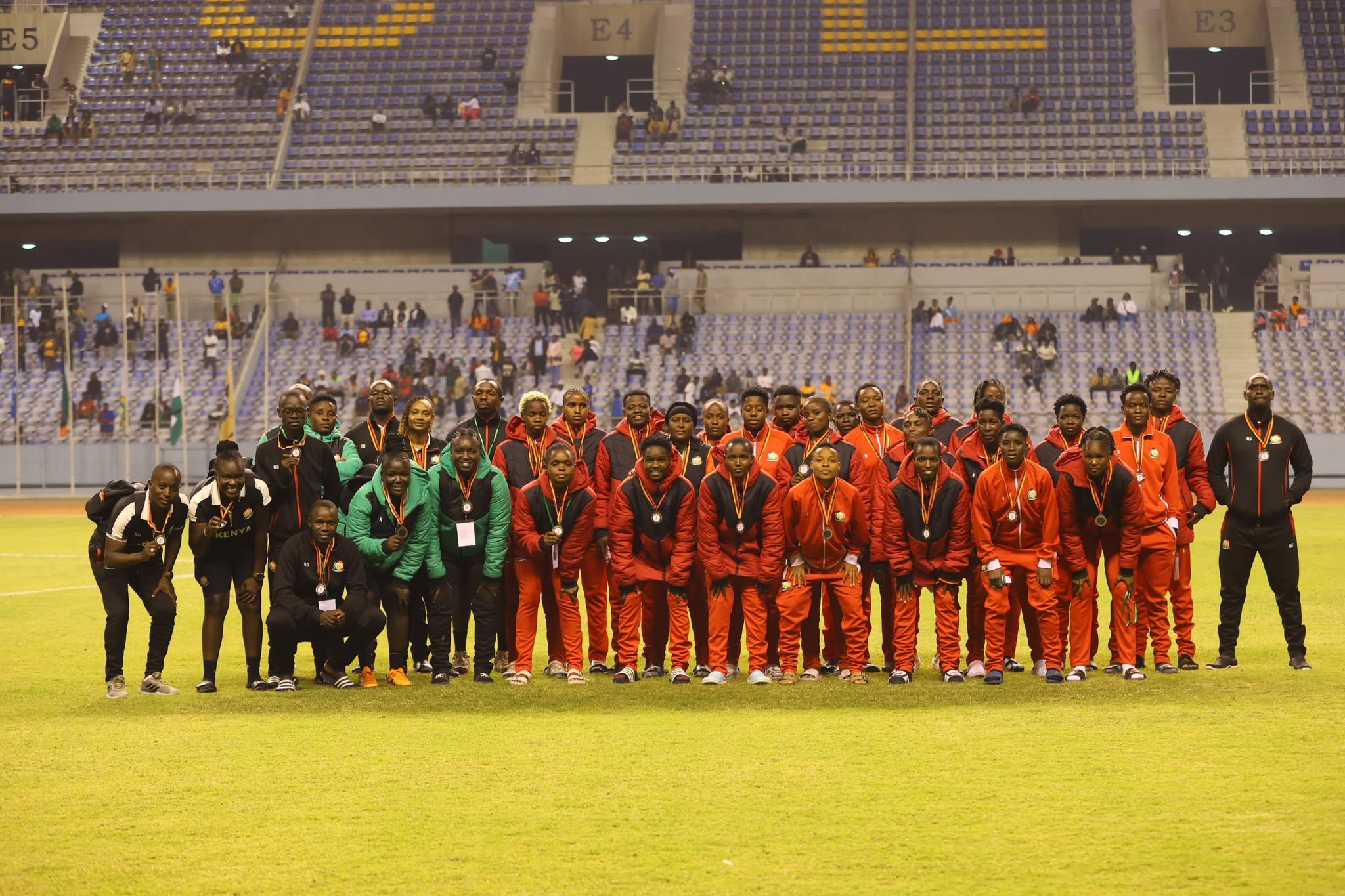 Harambee Starlets players celebrating after scoring in Zambia